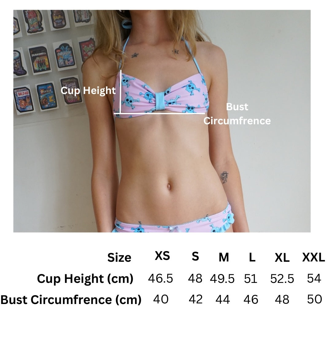 size chart for pink bikini top with blue accents and blue skull pattern