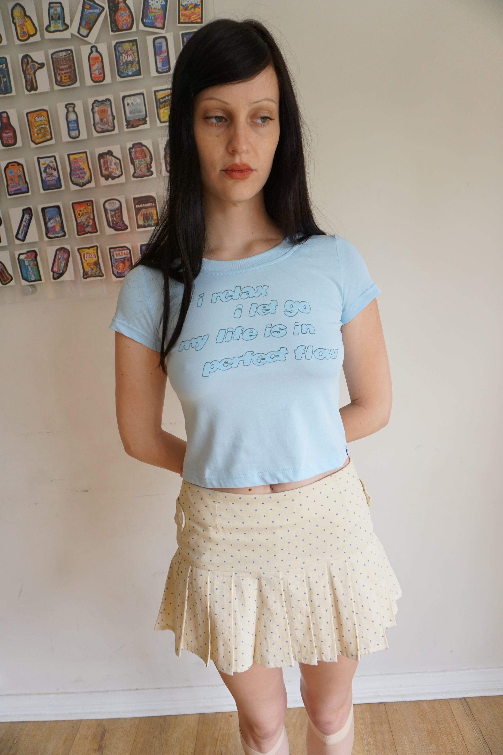 Light blue baby tee with a quote about relaxing 